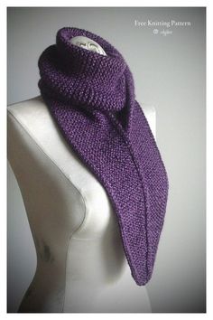 a purple knitted scarf sitting on top of a mannequin's head