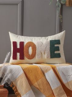 a decorative pillow with the word home on it