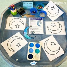 the tray is filled with different kinds of crafts for kids to make and play on