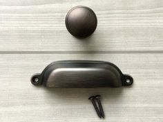 an image of a door handle with screws on it