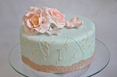 a cake decorated with flowers on a glass plate