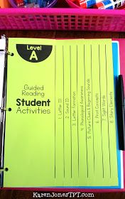 a student's workbook is sitting on top of a desk with pens and pencils