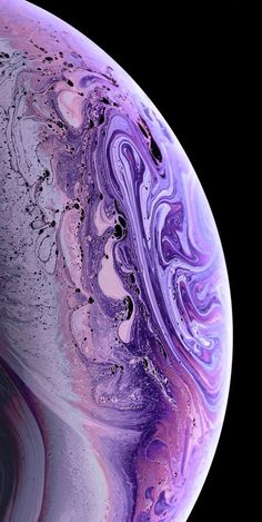 the back side of an iphone xr with purple and blue swirls on it