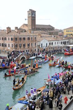 many people are on boats in the water