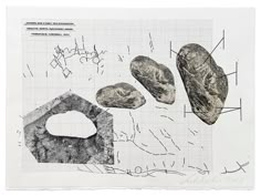 some rocks are shown on a piece of paper with other things in front of them