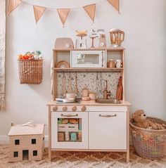 a play kitchen with toys and accessories in it