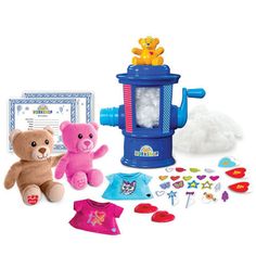 two teddy bears are sitting next to a toy lantern and other toys on a white background