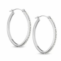 A bit of dazzle, a touch of fascination. Bring on the shine! These medium sized 14K white gold hoop earrings are perfectly charming with one diamond accent accompanying the beautiful diamond enamel bead design. Wear these hinged back hoops for everyday posh style. Diamond Fascination™ is a patent handmade process which crystallizes diamond dust into enamel to simulate round-cut diamonds. Diamond Hoop Earrings Medium, Black Diamond Hoop Earrings, White Gold Hoop Earrings, White Gold Diamond Earrings, White Gold Hoops, Medium Hoop Earrings, Diamond Dust, Posh Style, E Commerce Website