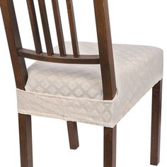 the back of a wooden chair with a white upholstered seat and wood frame