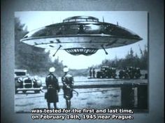 an old black and white photo shows two men standing in front of a flying object