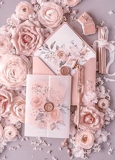 wedding stationery with pink flowers and gold accents