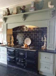 an old fashioned stove and oven in a kitchen