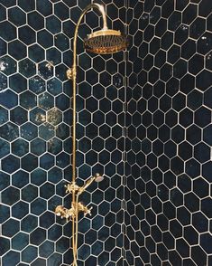 the shower head is gold in color