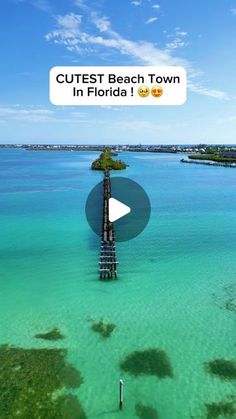 an aerial view of the ocean and pier with text that reads cutest beach town in florida