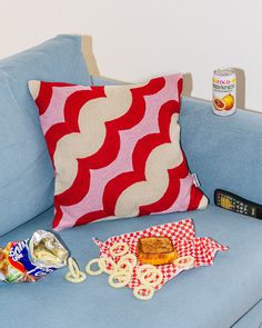 a blue couch with some snacks on it