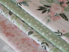 four different types of fabric with flowers and dots on them, all in pastel colors