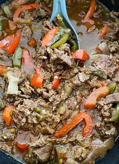 a pot filled with meat and vegetables on top of a stove