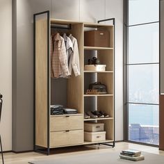 an open closet with clothes and shoes on shelves next to a table in front of a window