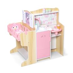 a wooden toy kitchen with pink appliances and accessories