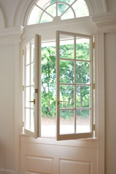 an open window with the light coming in from it's center and side windows