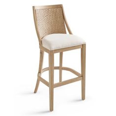 a wooden bar stool with white upholstered back and seat cushion on an isolated white background