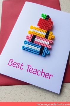 a greeting card with the words best teacher on it and an image of a beaded apple