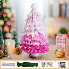 a christmas tree made out of yarn sitting on top of a table next to presents