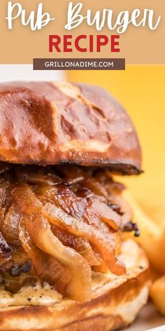 a close up of a burger on a plate with french fries