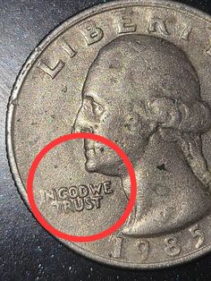 an image of a coin with a red circle on it's side and the word,