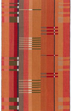 an orange and brown rug with stripes on it