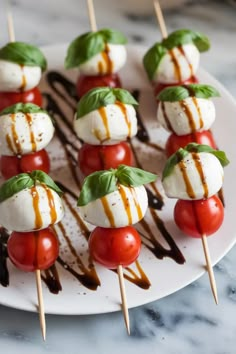 A photo of a  Caprese Skewers a New Years Snacks New Year's Eve Snacks, Nye Hors D’oeuvres, New Years Day Appetizer, Nye Party Desserts, Nye Party Snacks, New Year Snack Ideas, New Years Eve Baking, New Year Eve Party Food, New Year Eve Snacks