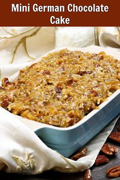 a close up of a casserole dish with pecans in the background and text overlay reading mini german chocolate cake