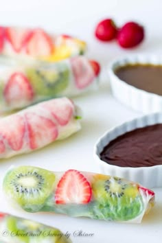 fruit rolls with chocolate dipping sauce and strawberries