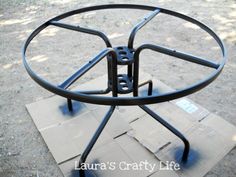 a metal object sitting on top of a cardboard box