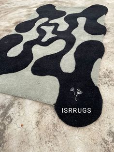 an area rug with black and white designs on it