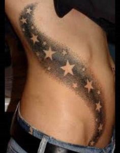 the back of a man's stomach with stars on it