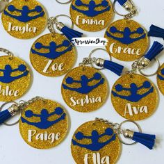 six personalized key chains with blue and gold glitter