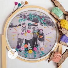 a couple of people that are standing in front of a embroidery