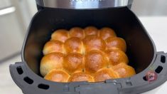 the buns are being cooked in an air fryer for breakfast or dessert,