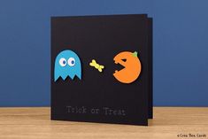 there is a card that says trick or treat with two pacman faces on it