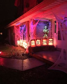 a house decorated with halloween decorations and lights