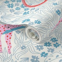 an animal themed wallpaper with pink and blue flowers on it's side, next to a roll of toilet paper