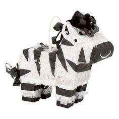 an animal made out of toilet paper with black and white stripes on it's body