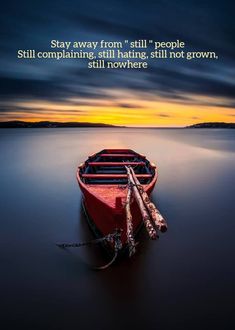 a red boat sitting on top of a lake under a cloudy sky with a quote above it