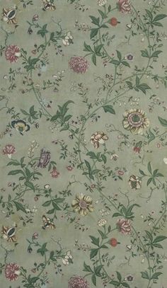 an old wallpaper with many flowers and leaves on the side, in shades of green