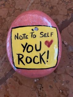 a rock with a note to self you rock written on it and a heart in the middle