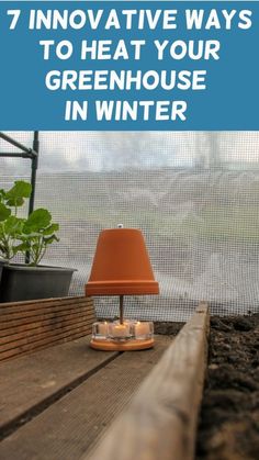 an orange lamp sitting on top of a wooden table next to a window sill