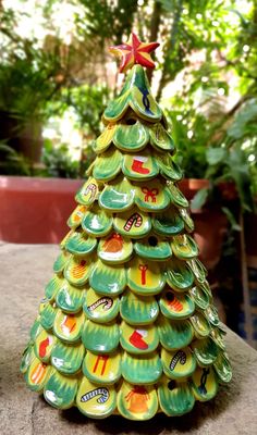 a ceramic christmas tree sitting on top of a table