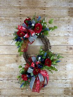 a wreath with red, white and blue flowers