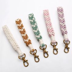 four different colors of rope with metal handles